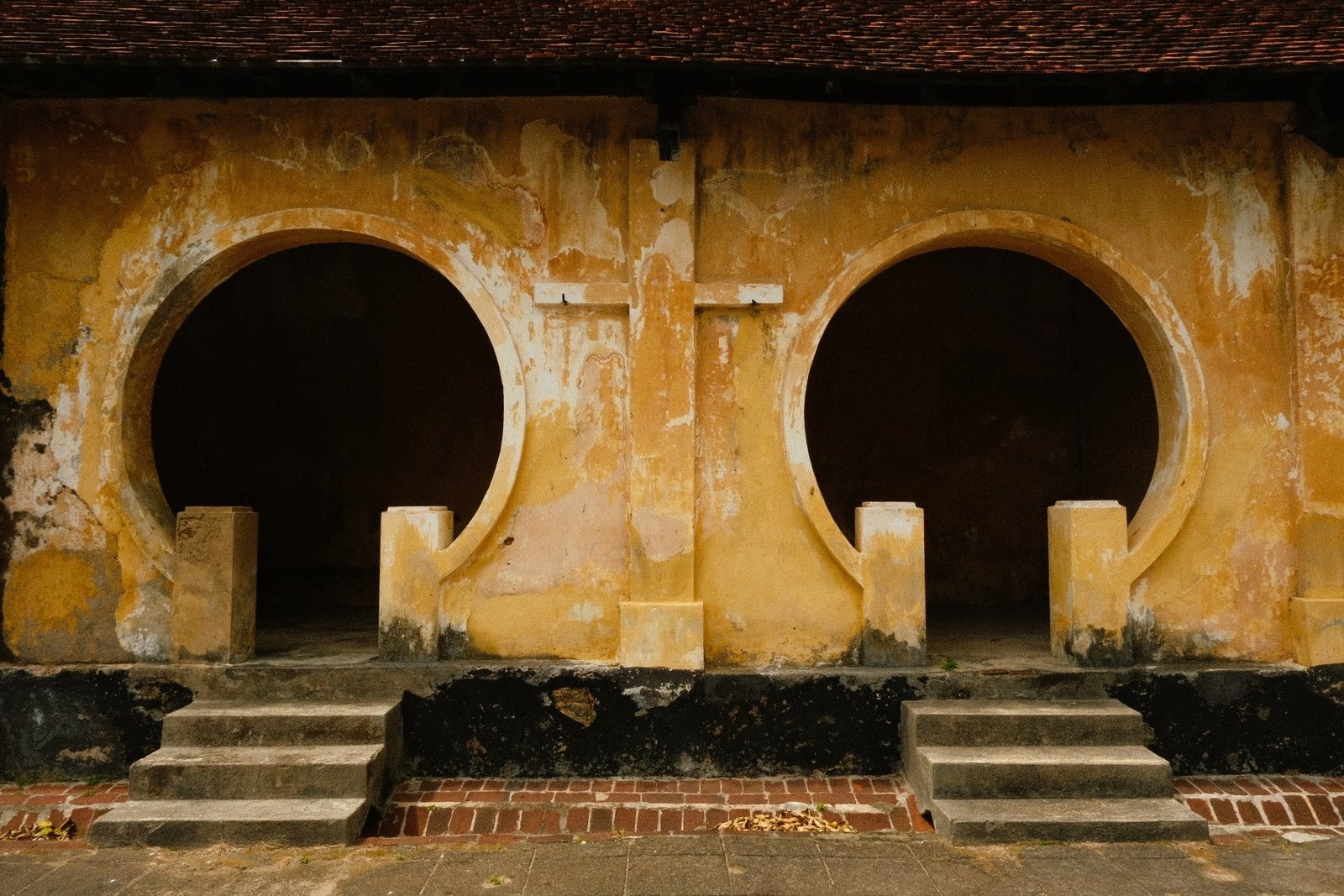 Weathered brick structures within the Con Dao prison complex