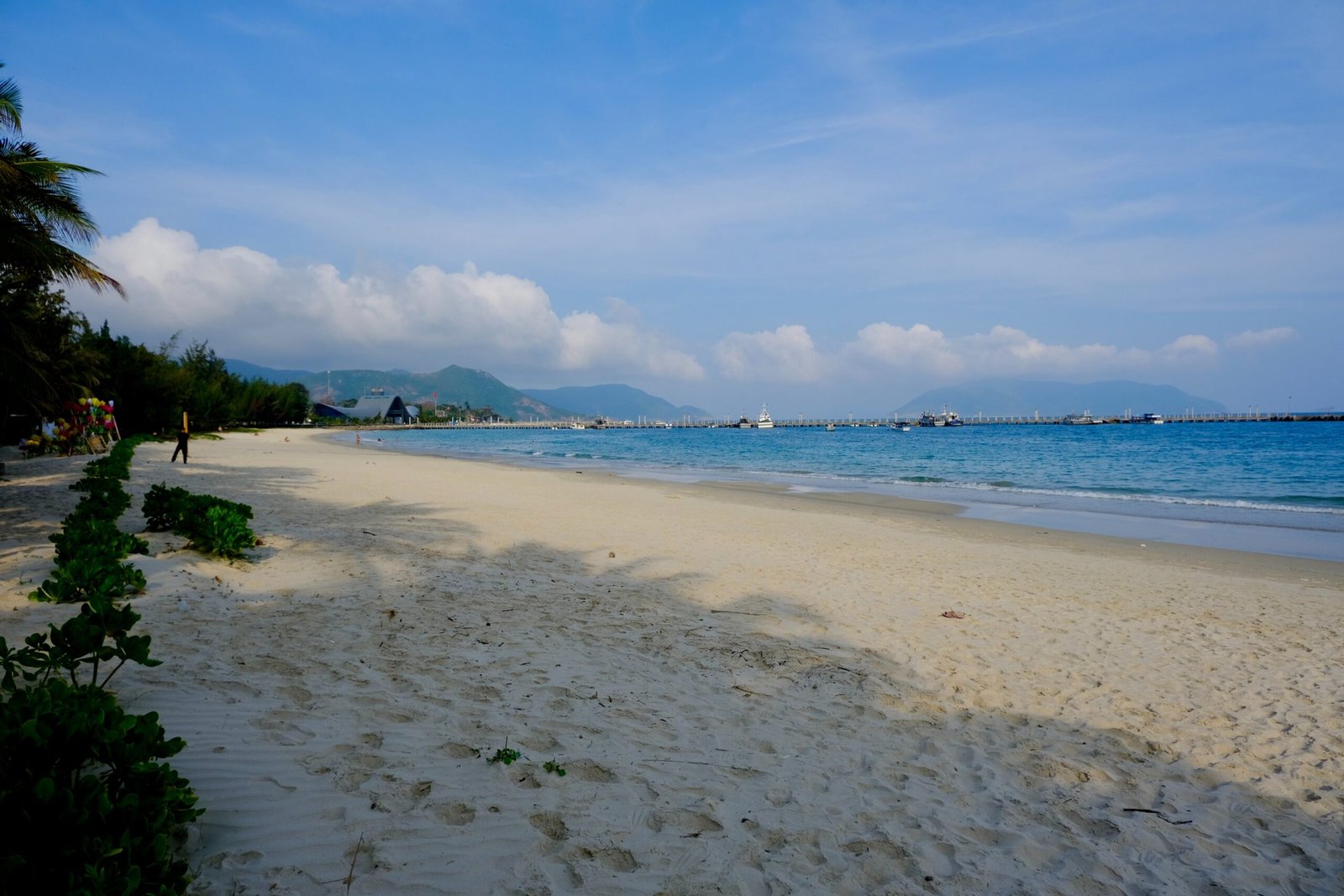 Clear coastal road along Con Dao with mountains in the distance