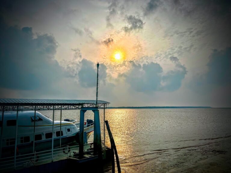 Superdong ferry boat moored at a small jetty at sunset