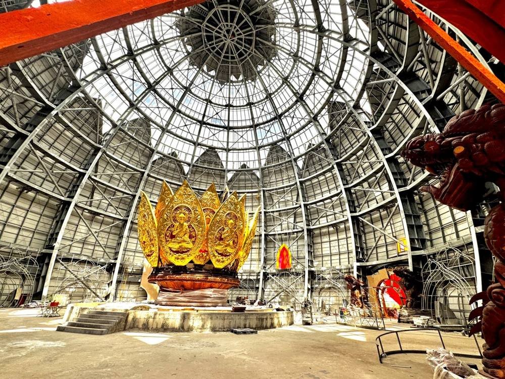 Exposed steel dome of Liên Hoa Bảo Tháp under construction with the golden Buddha centrepiece already in place
